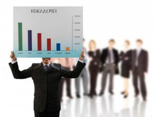 Businessman Holding Graph --- Image by © Royalty-Free/Corbis